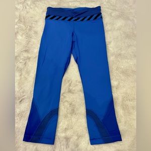 Lululemon royal blue capris with black stripe details. Size 4